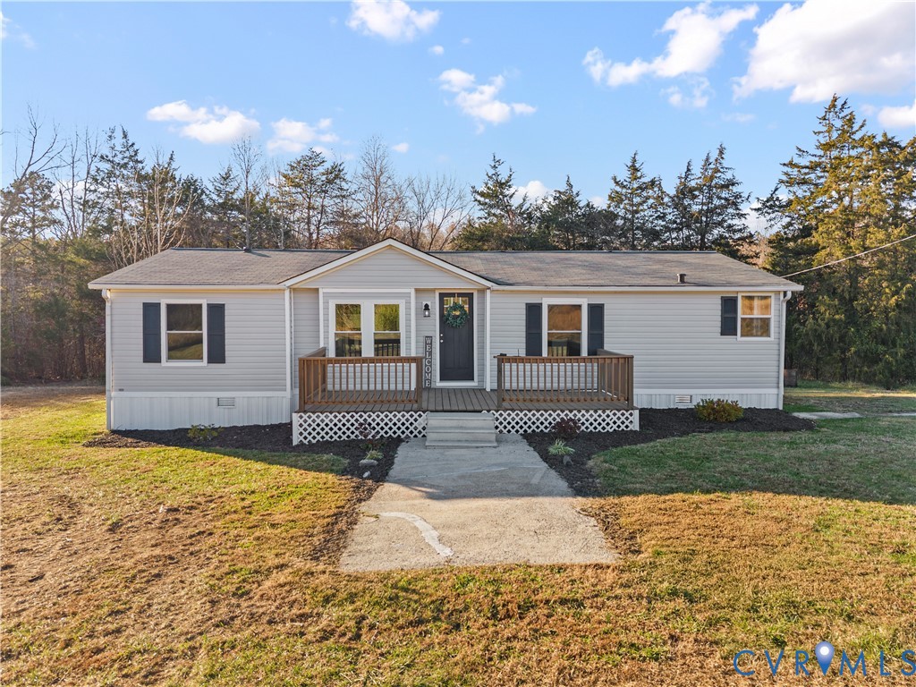 4621 Meherrin Road Meherrin, VA 23954 - Photo 2 of 49 a view of a yard in front of a house with a large tree