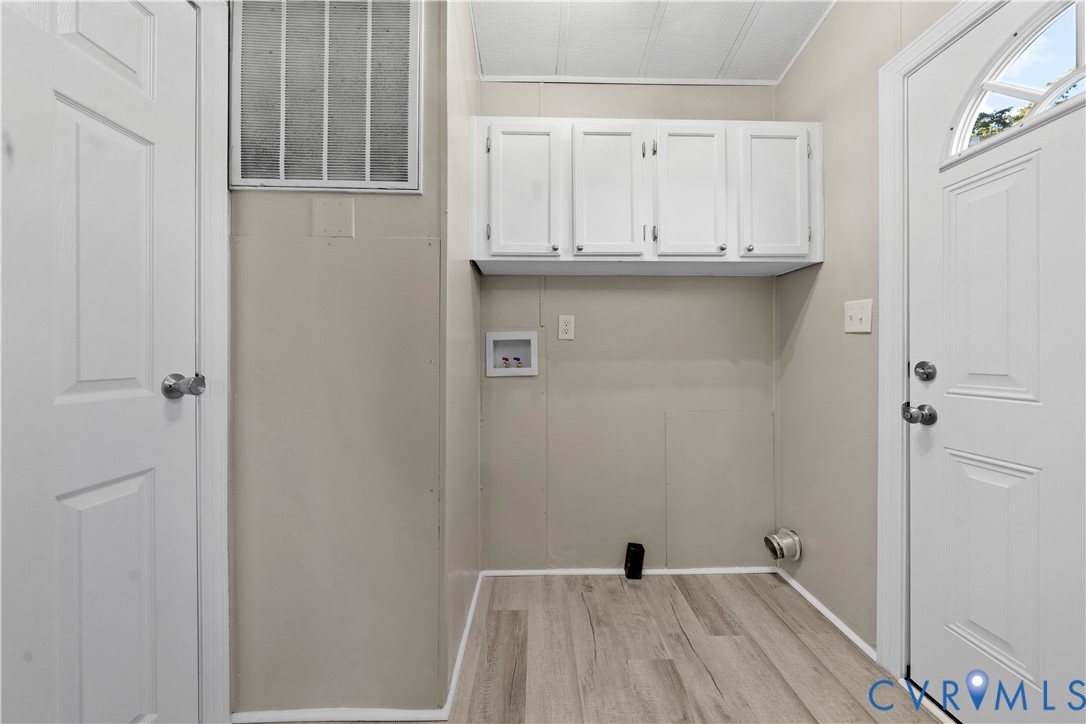 4621 Meherrin Road Meherrin, VA 23954 - Photo 22 of 49 a view of a kitchen with white cabinets