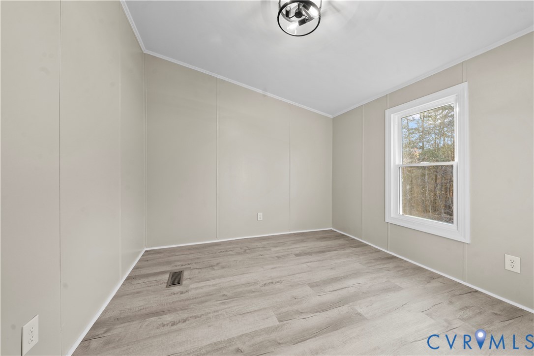 4621 Meherrin Road Meherrin, VA 23954 - Photo 23 of 49 an empty room with a window