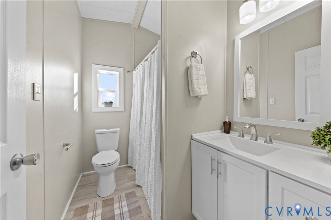 4621 Meherrin Road Meherrin, VA 23954 - Photo 25 of 49 a bathroom with a sink toilet and shower