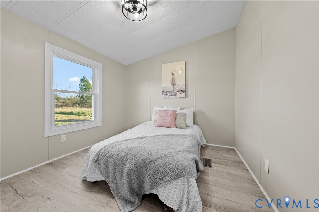 4621 Meherrin Road Meherrin, VA 23954 - Photo 26 of 49 a bedroom with a bed and a window