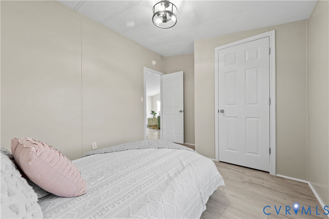 4621 Meherrin Road Meherrin, VA 23954 - Photo 27 of 49 a bedroom with a bed and a table