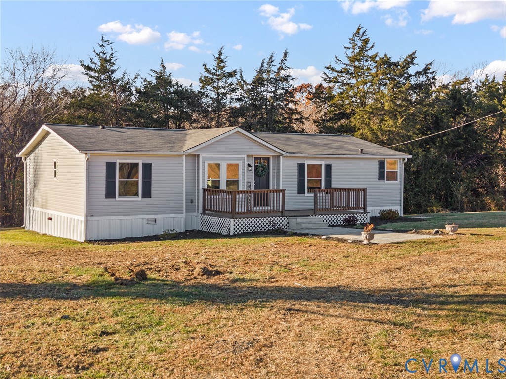 4621 Meherrin Road Meherrin, VA 23954 - Photo 40 of 49 a front view of a house with a garden and yard