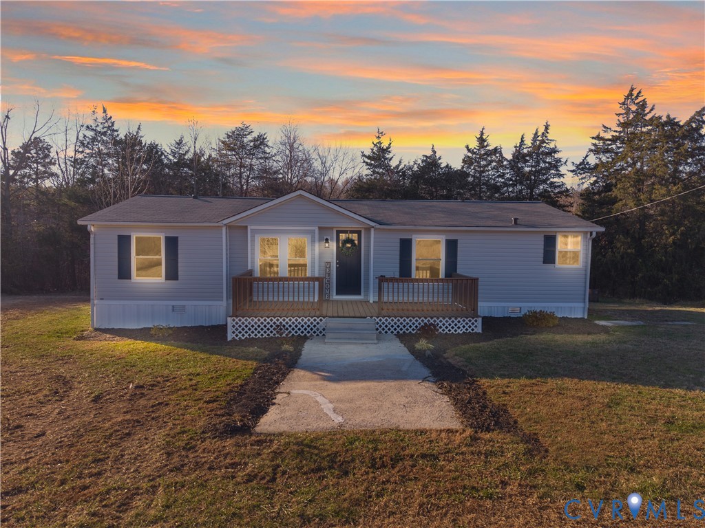 4621 Meherrin Road Meherrin, VA 23954 - Photo 42 of 49 a front view of a house with a yard and garage