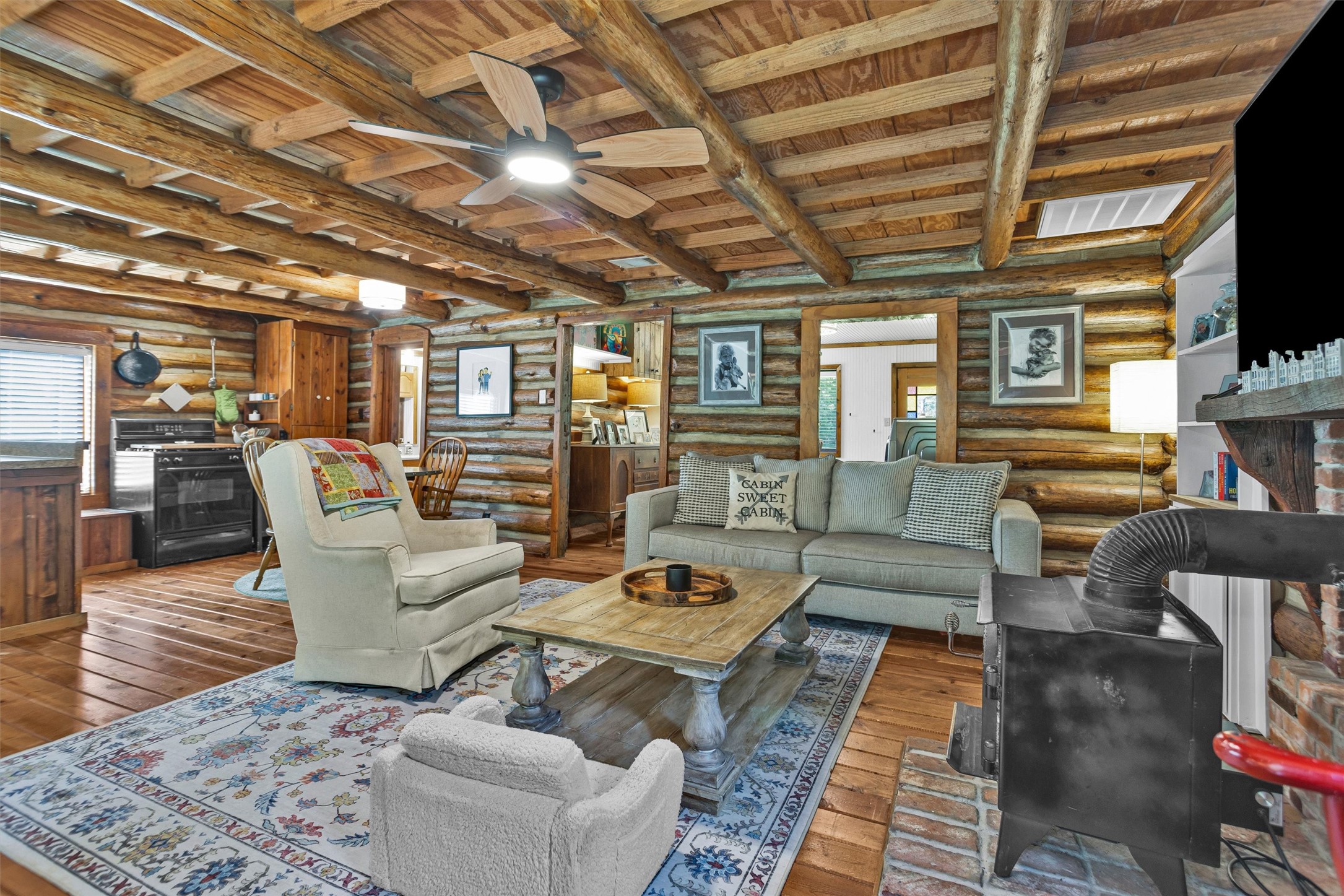 1356 Pegoda Ranch Road Groveton, TX 75845 - Photo 12 of 44 a living room with furniture and a flat screen tv