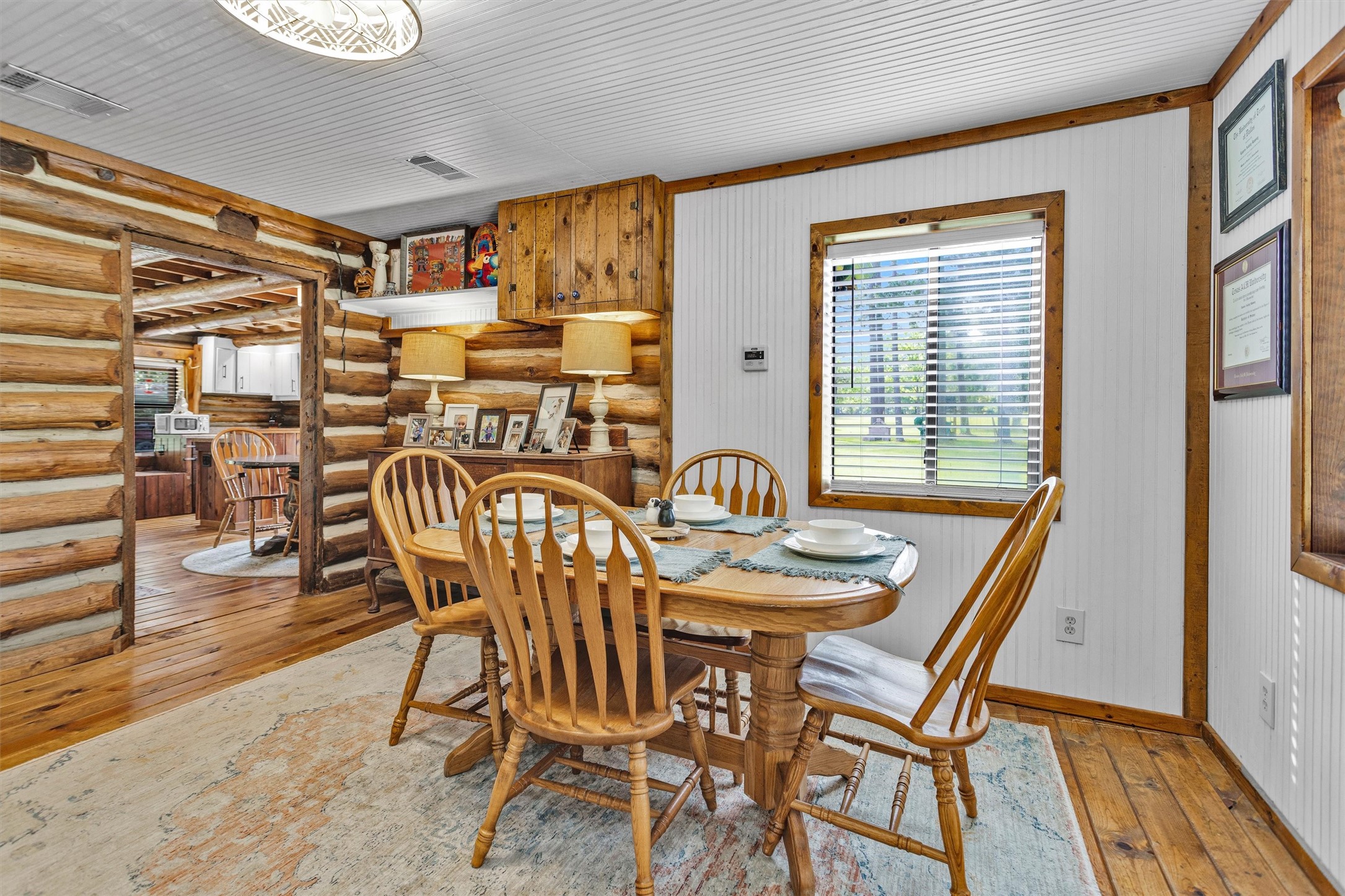 1356 Pegoda Ranch Road Groveton, TX 75845 - Photo 22 of 44 a table and chairs in a room