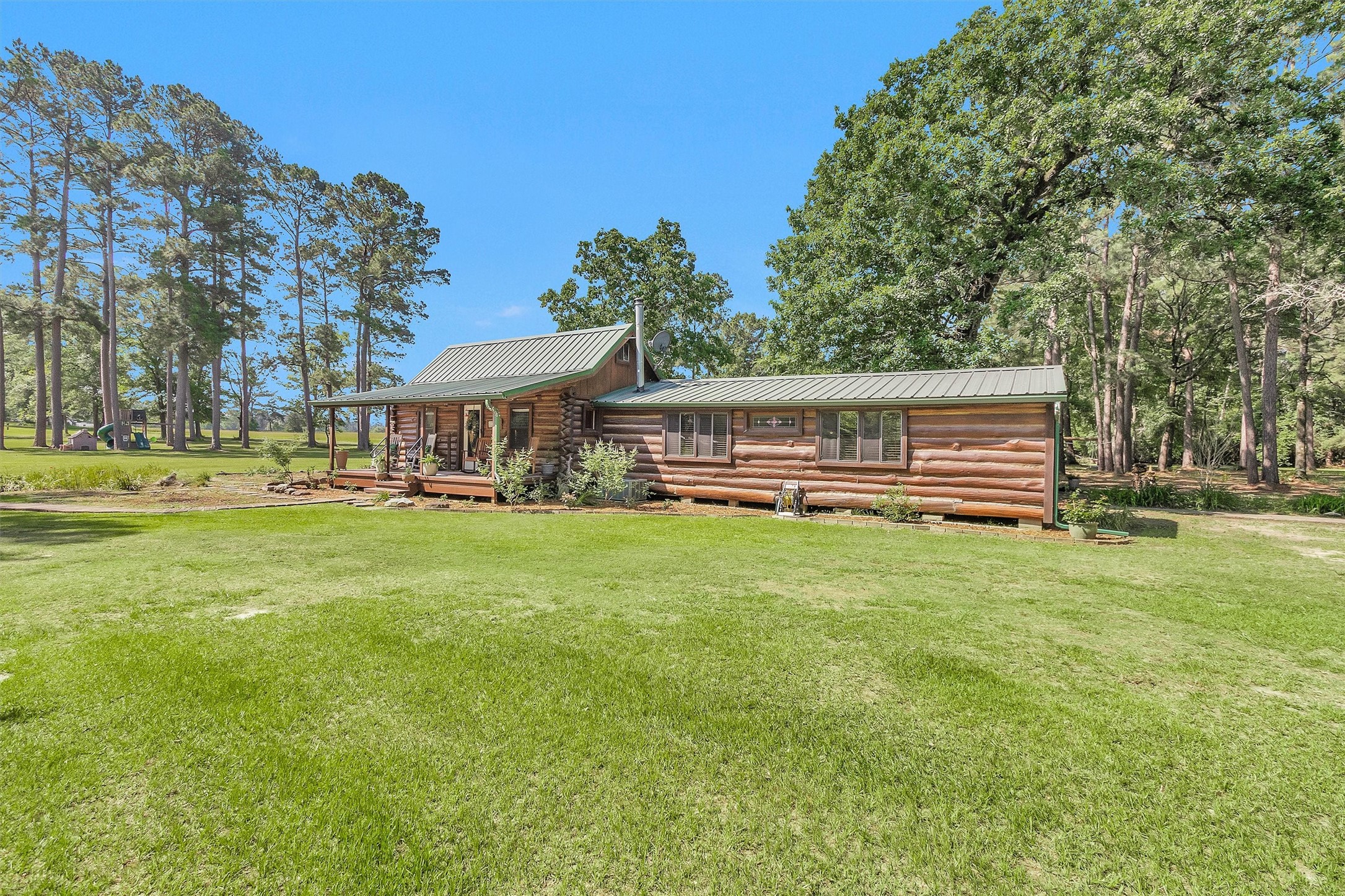 1356 Pegoda Ranch Road Groveton, TX 75845 - Photo 6 of 44 a front view of a house with a yard
