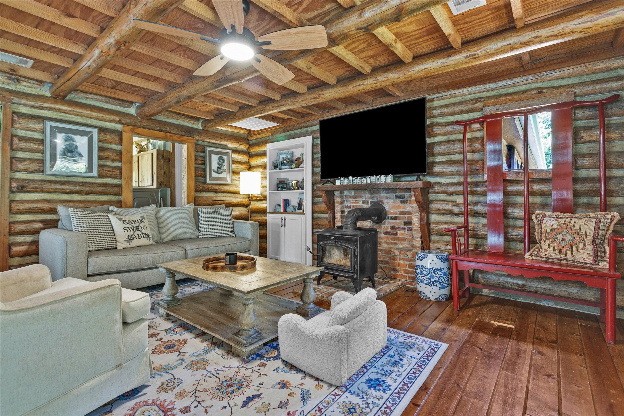 1356 Pegoda Ranch Road Groveton, TX 75845 - Photo 10 of 44 a living room with furniture a flat screen tv and a table