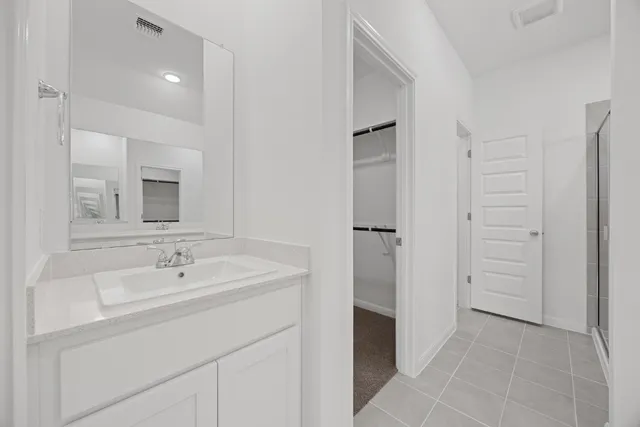 a picture of a room with a white wall and a large window