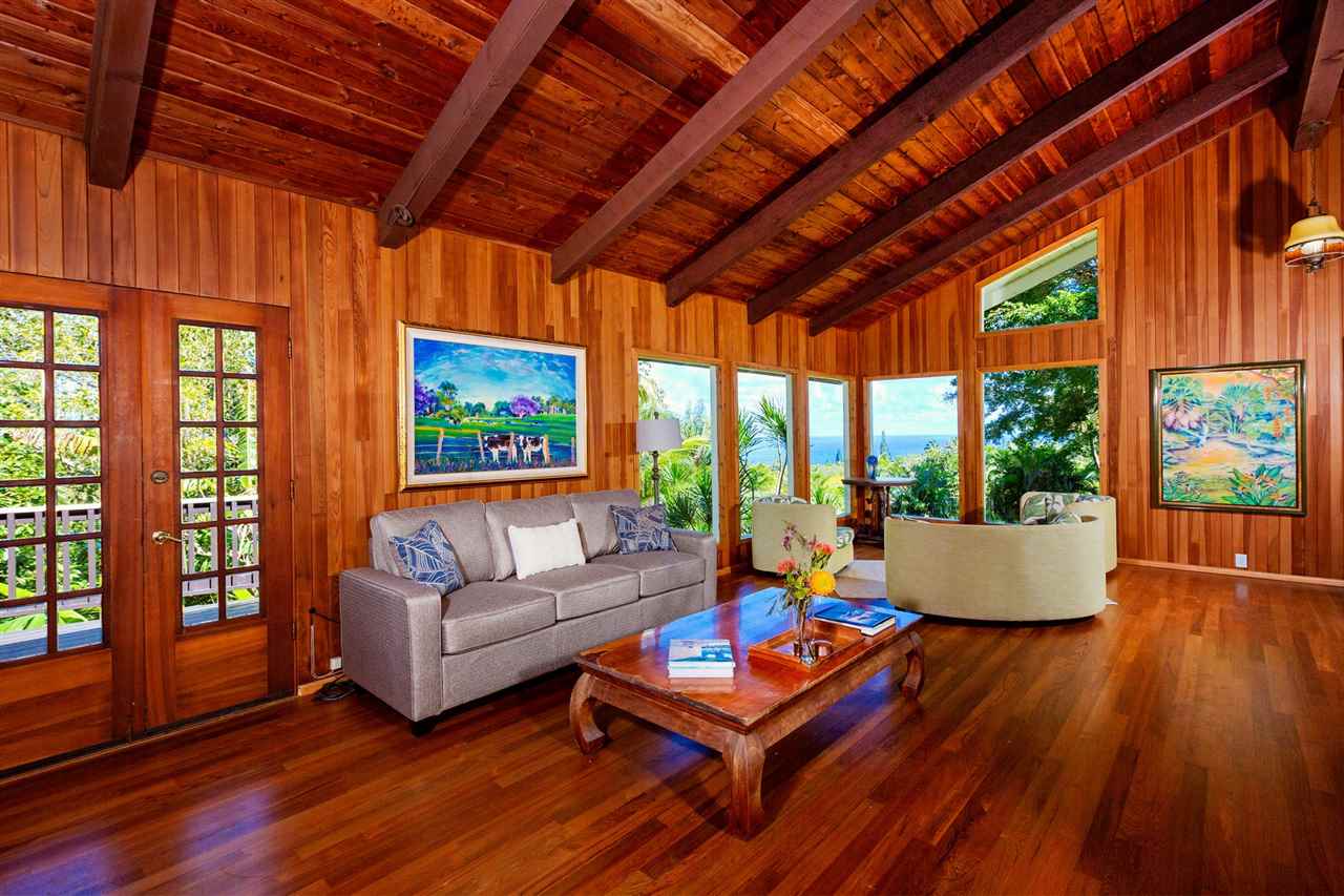 245 North Honokala Road Haiku, HI 96708 - Photo 1 of 17 a living room with furniture and a large window