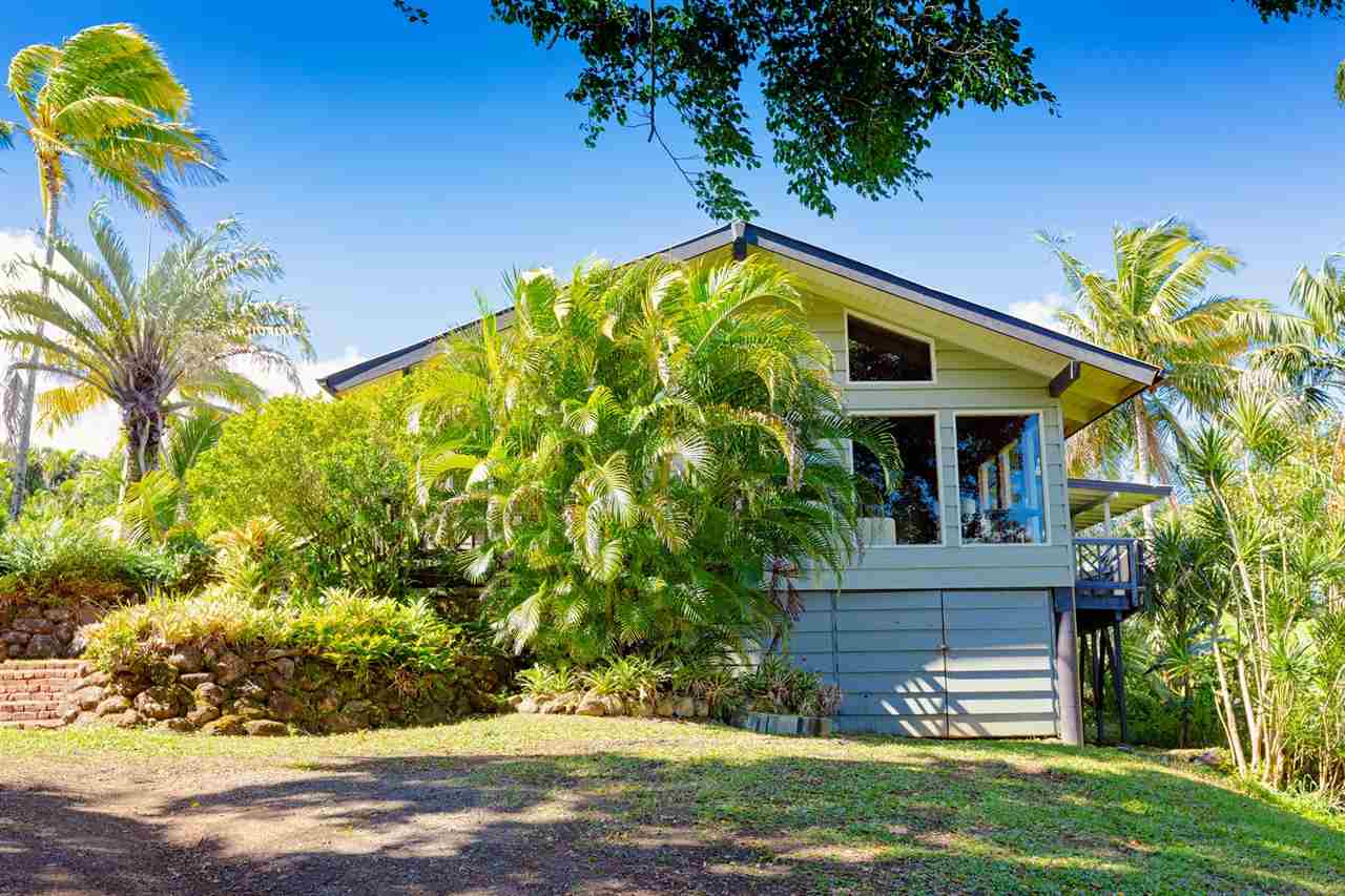 245 North Honokala Road Haiku, HI 96708 - Photo 13 of 17 a front view of a house with a yard