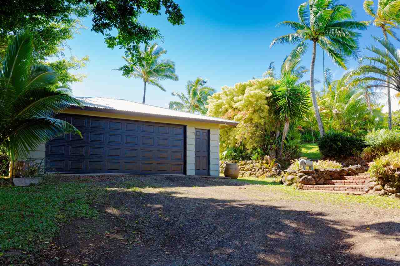 245 North Honokala Road Haiku, HI 96708 - Photo 14 of 17 a front view of a house with a yard