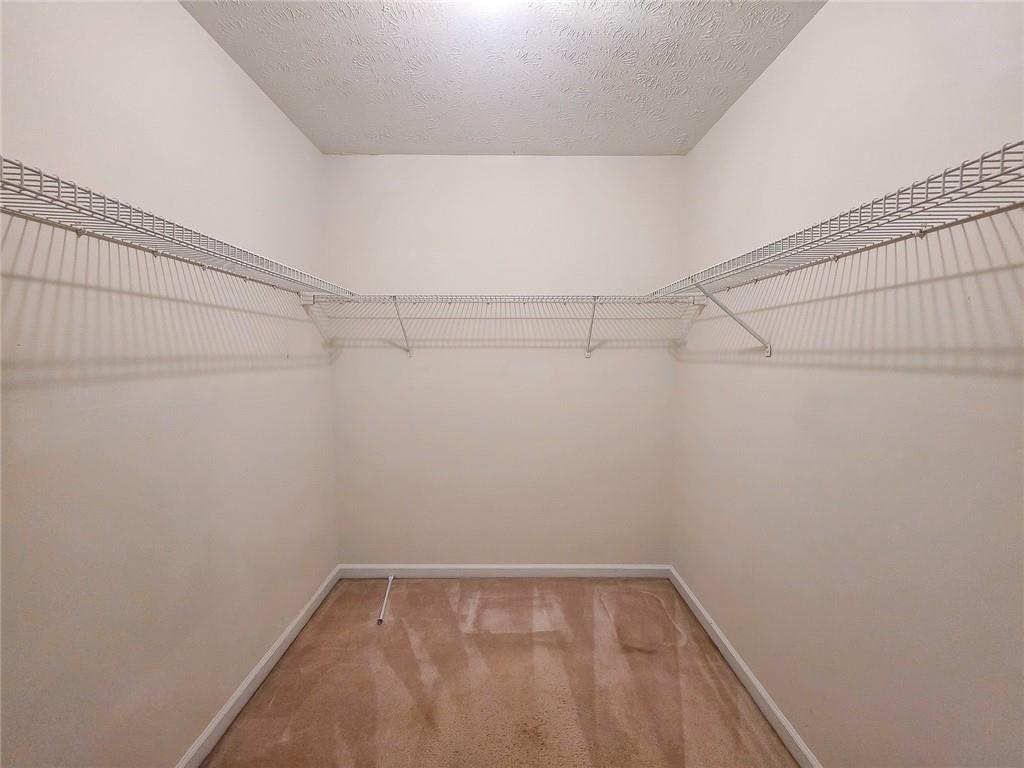 355 Austin Way Auburn, GA 30011 - Photo 14 of 19 a view of a room with racks on the wall