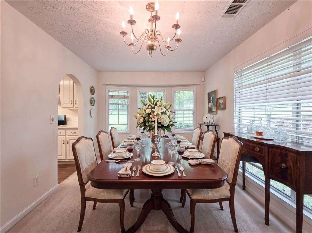 355 Austin Way Auburn, GA 30011 - Photo 7 of 19 a view of a dining room with furniture window and outside view