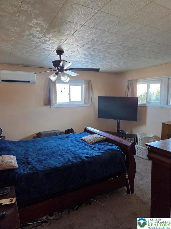 14 Magna Drive Coplay, PA 18037 - Photo 12 of 23 a bedroom with a bed table chair and window