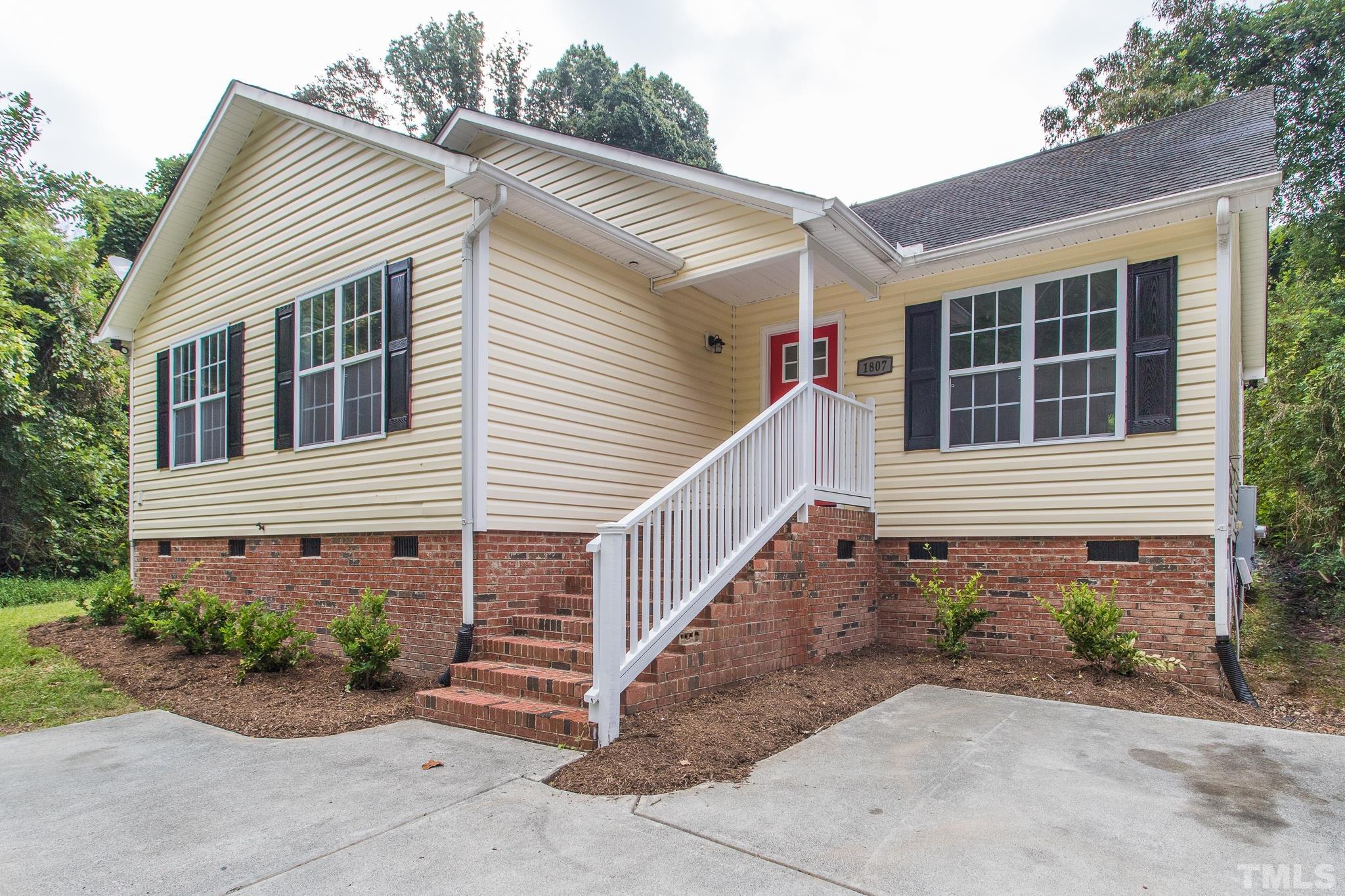 1807 South Roxboro Street Durham, NC 27707 - Photo 2 of 27 a view of a house with a yard