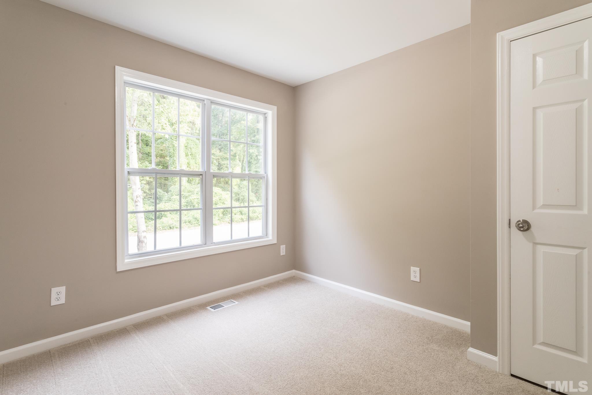 1807 South Roxboro Street Durham, NC 27707 - Photo 18 of 27 an empty room with a window