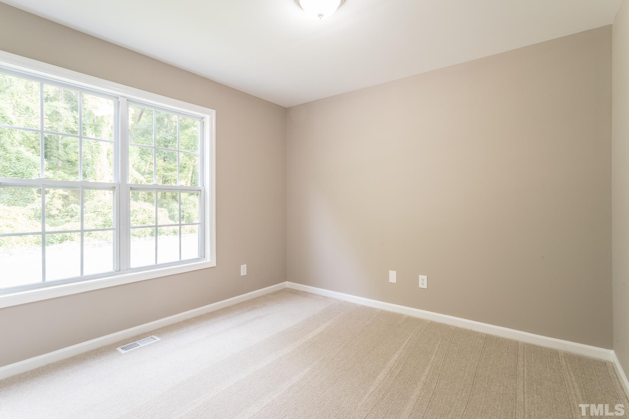 1807 South Roxboro Street Durham, NC 27707 - Photo 21 of 27 a view of an empty room with a window
