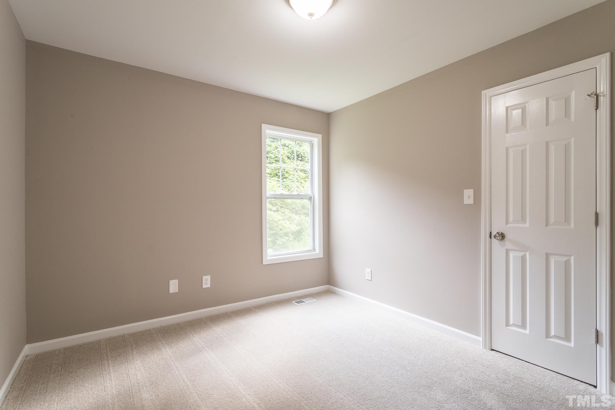 1807 South Roxboro Street Durham, NC 27707 - Photo 23 of 27 a view of an empty room with a window