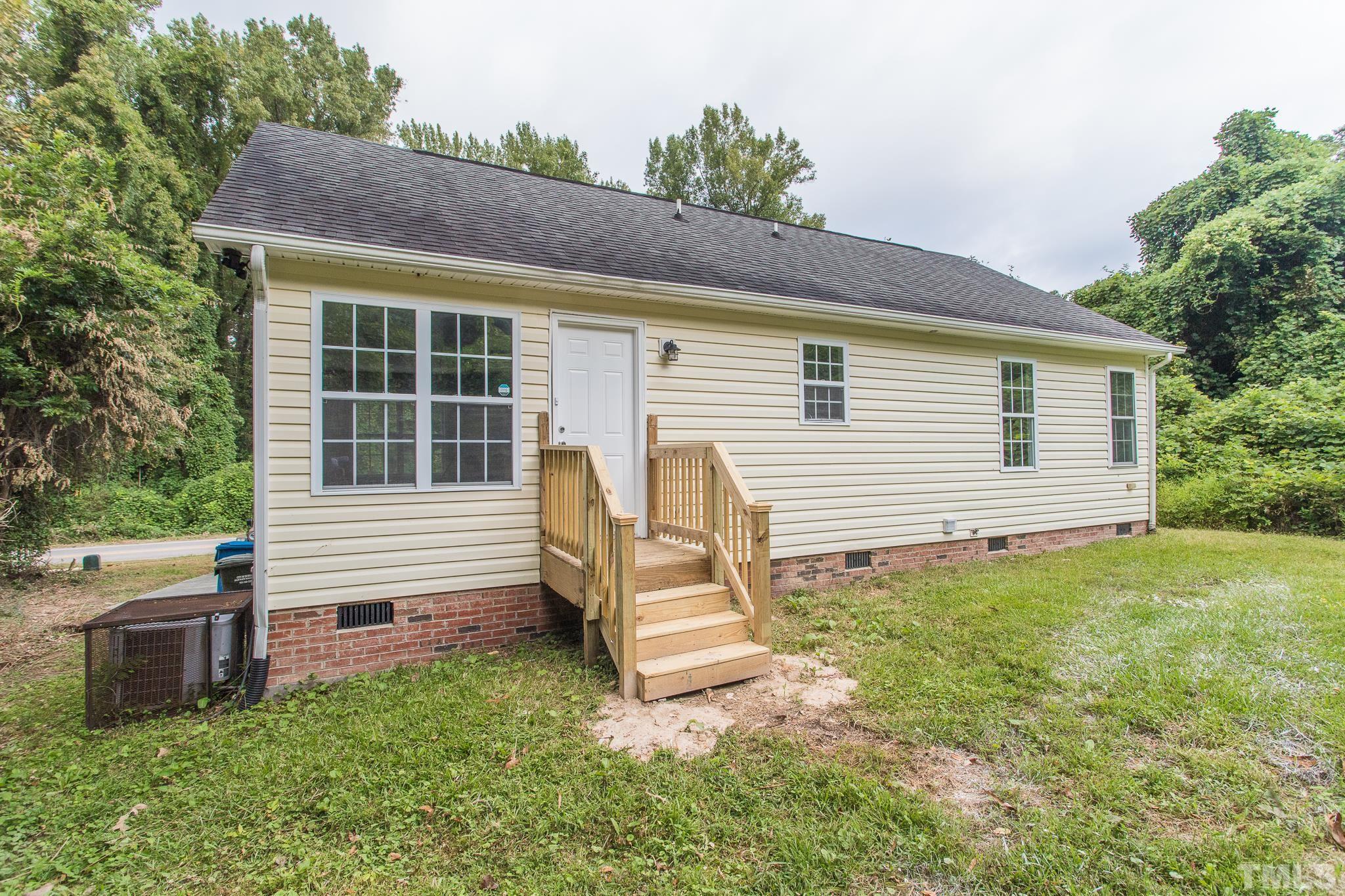 1807 South Roxboro Street Durham, NC 27707 - Photo 24 of 27 a view of a house with a yard and sitting area