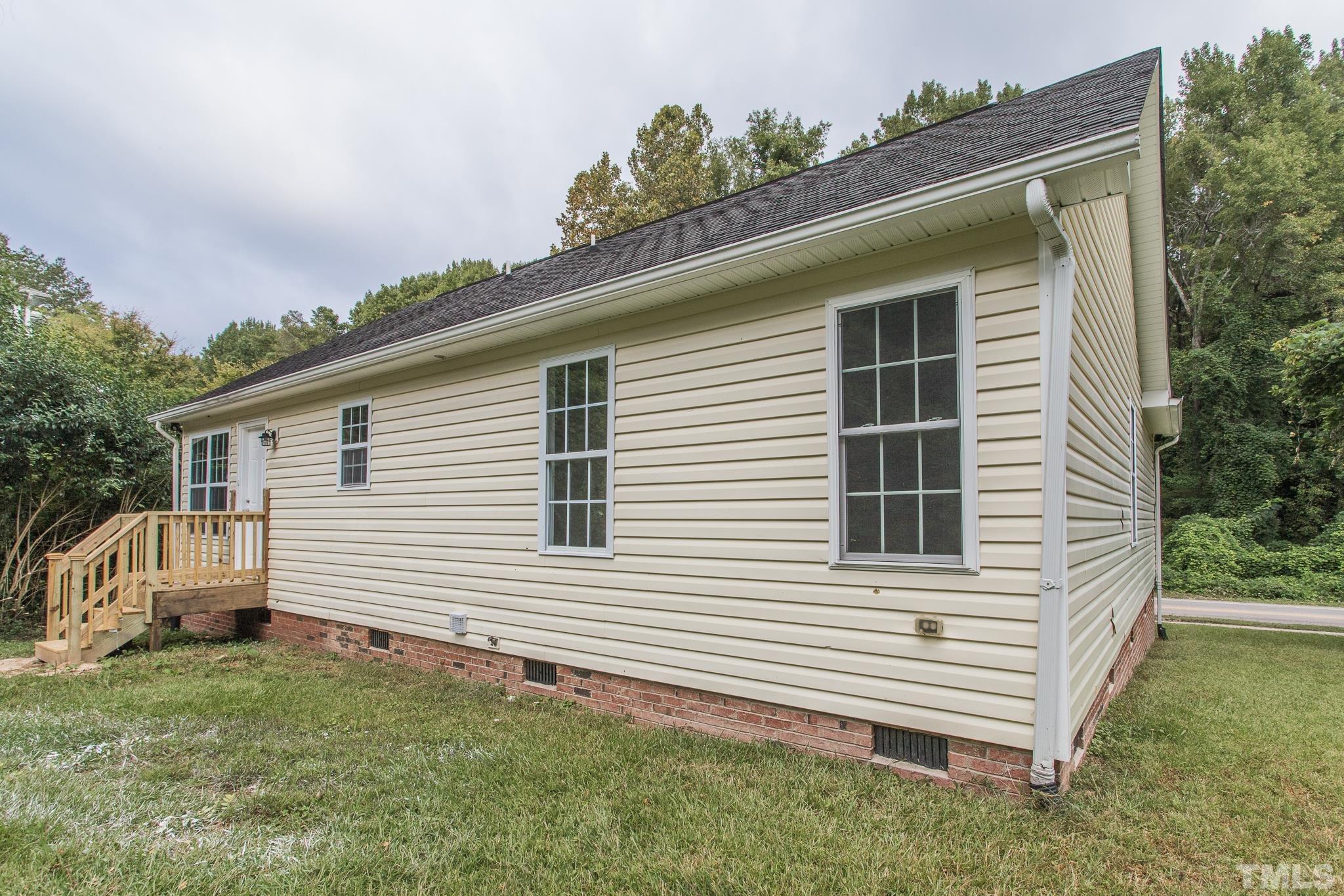 1807 South Roxboro Street Durham, NC 27707 - Photo 25 of 27 a view of a house with a yard and garage