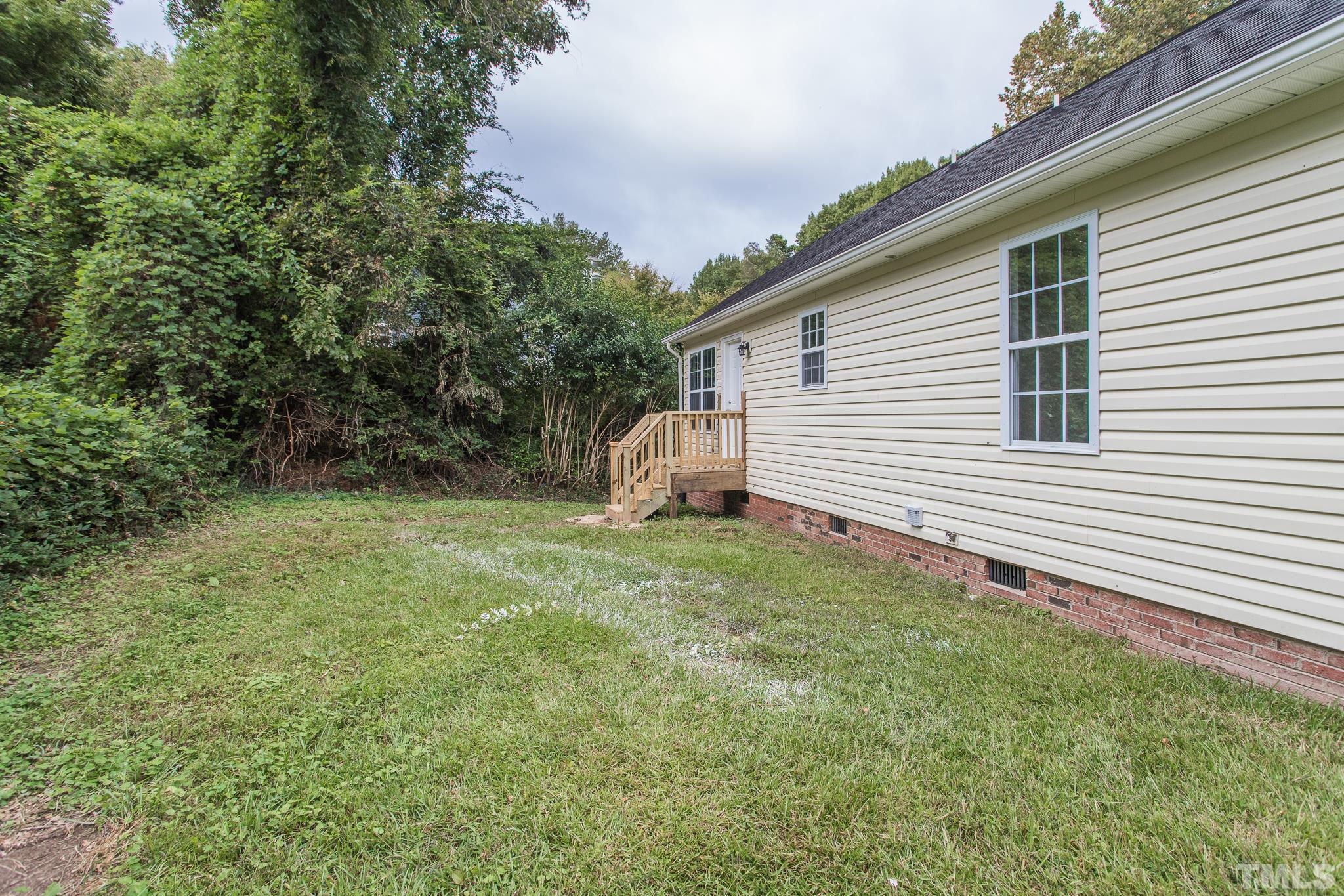 1807 South Roxboro Street Durham, NC 27707 - Photo 27 of 27 a view of a backyard with plants and large tree