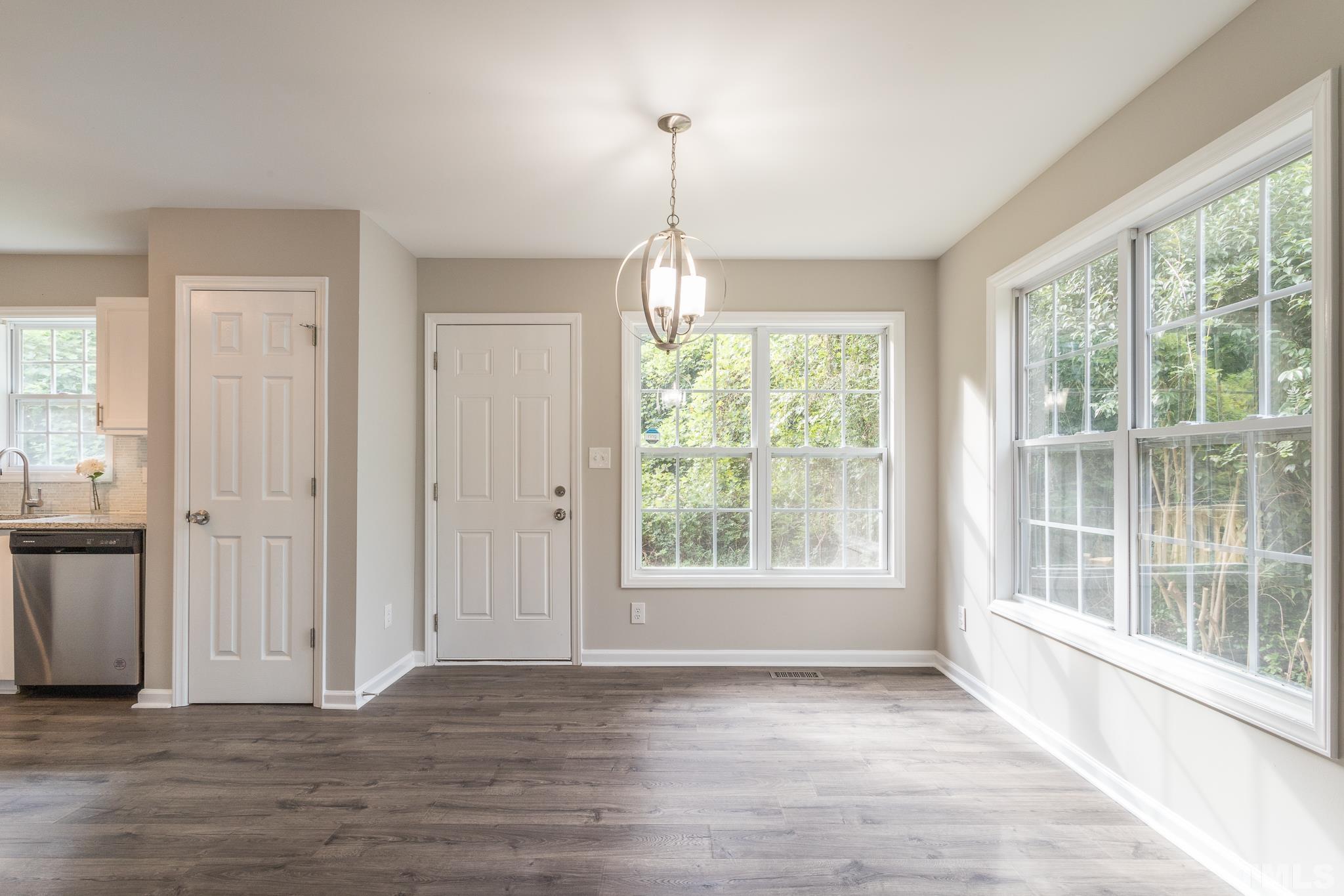 1807 South Roxboro Street Durham, NC 27707 - Photo 9 of 27 a view of empty room with wooden floor and fan