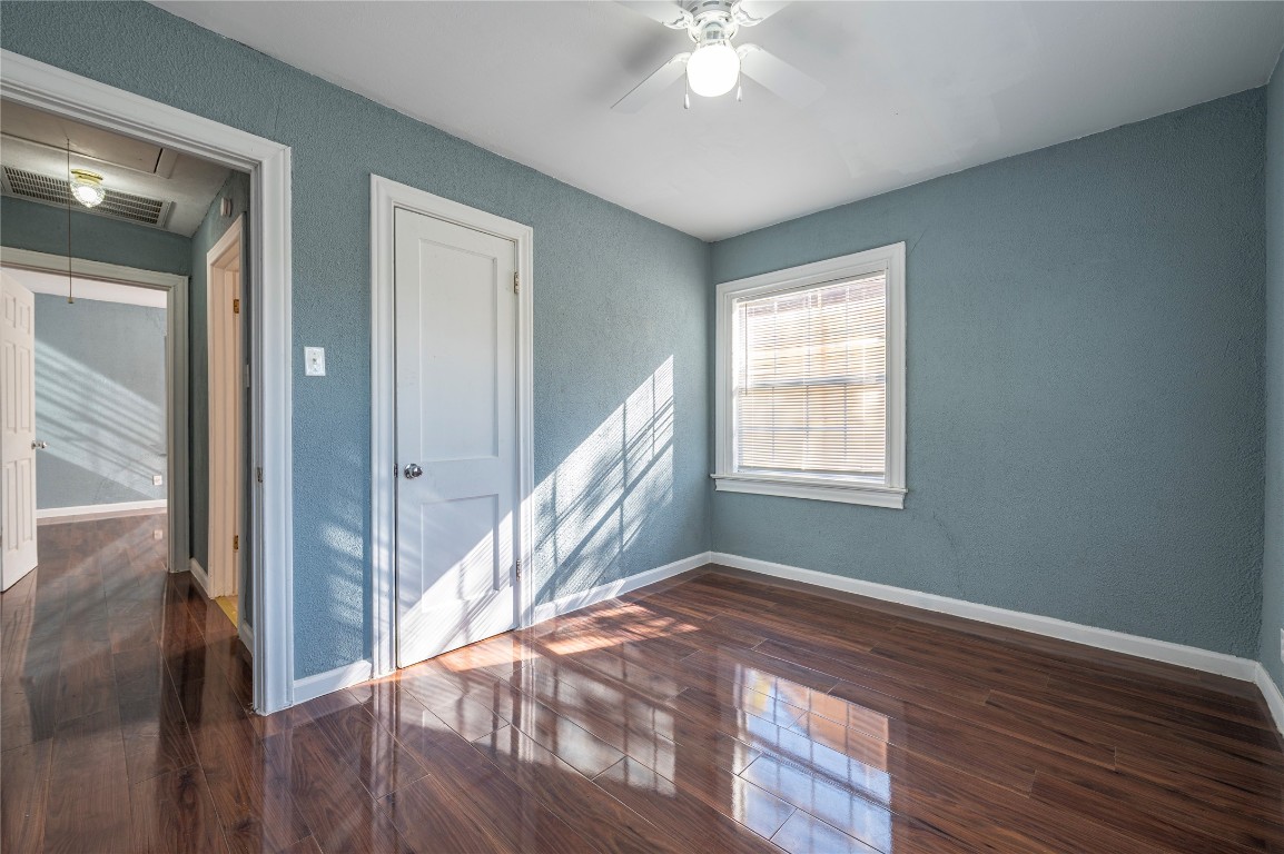 715 Center Street Pasadena, TX 77506 - Photo 14 of 33 a view of an empty room with wooden floor and a window