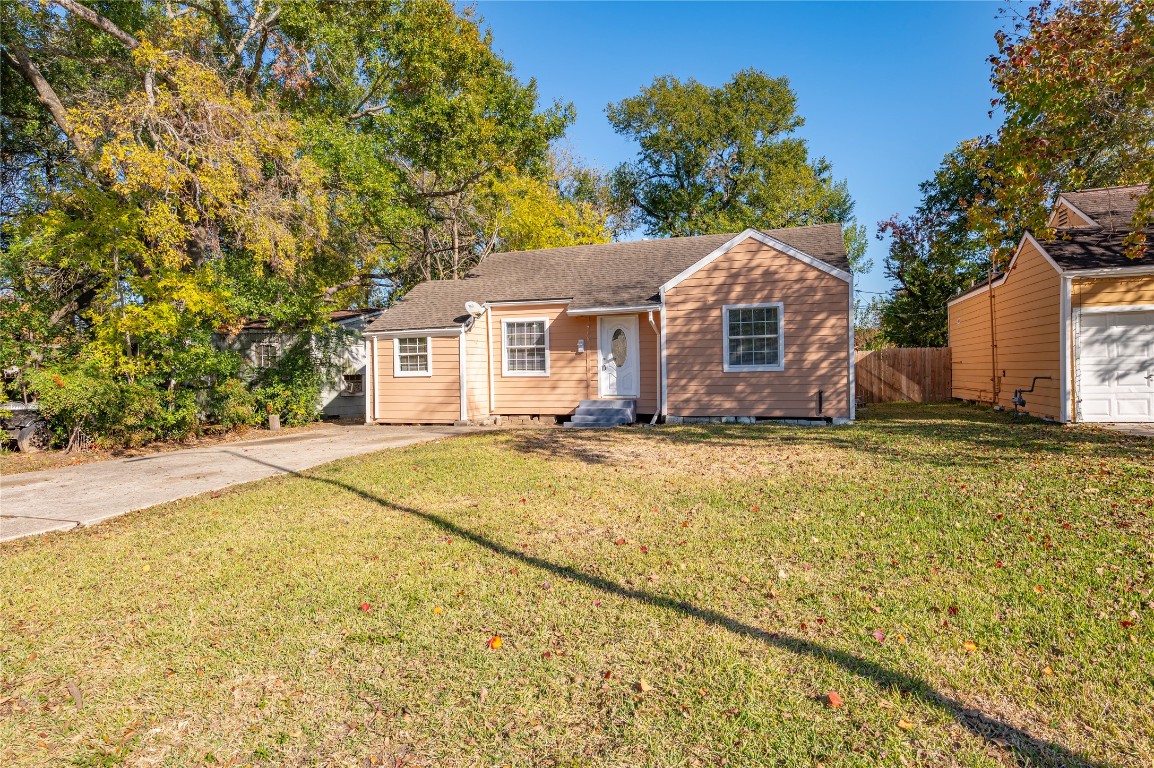 715 Center Street Pasadena, TX 77506 - Photo 2 of 33 a front view of house with yard and trees in the background
