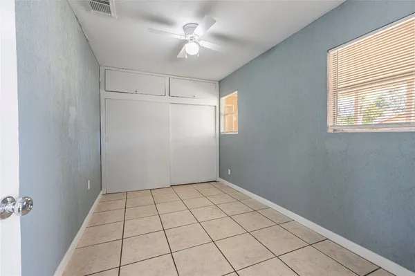 a view of an empty room with a window