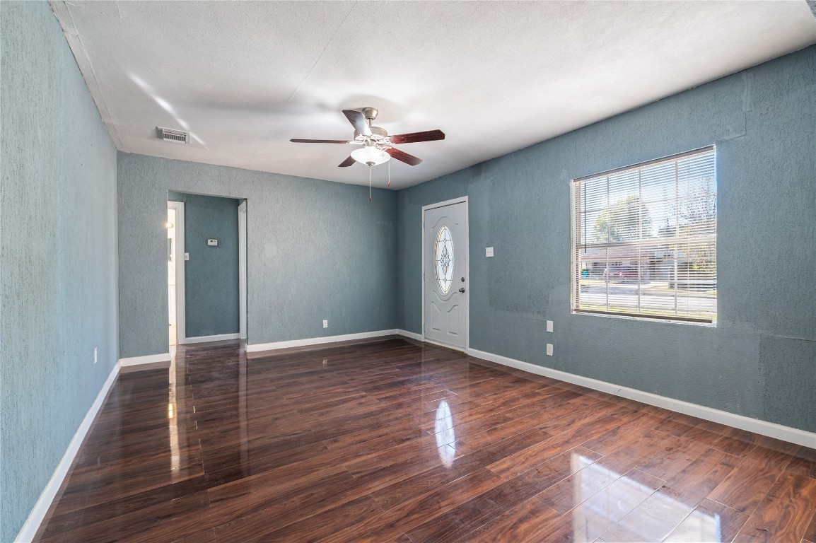 715 Center Street Pasadena, TX 77506 - Photo 4 of 33 a view of an empty room with window and wooden floor