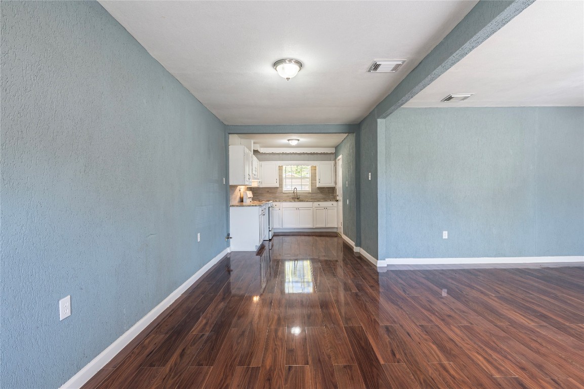 715 Center Street Pasadena, TX 77506 - Photo 8 of 33 a view of a room with wooden floor and a window