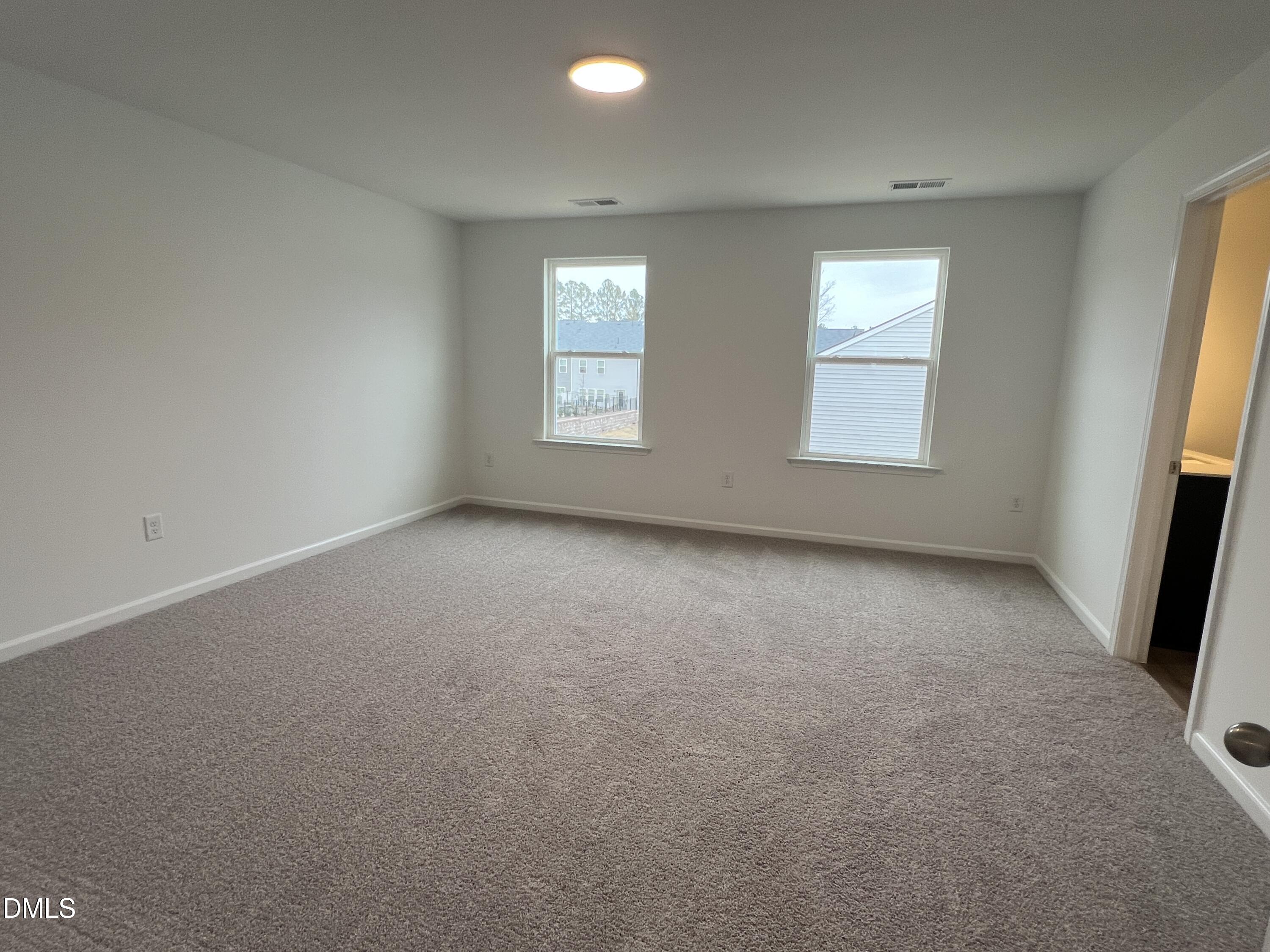 2017 Regal Drive Durham, NC 27703 - Photo 11 of 28 an empty room with windows