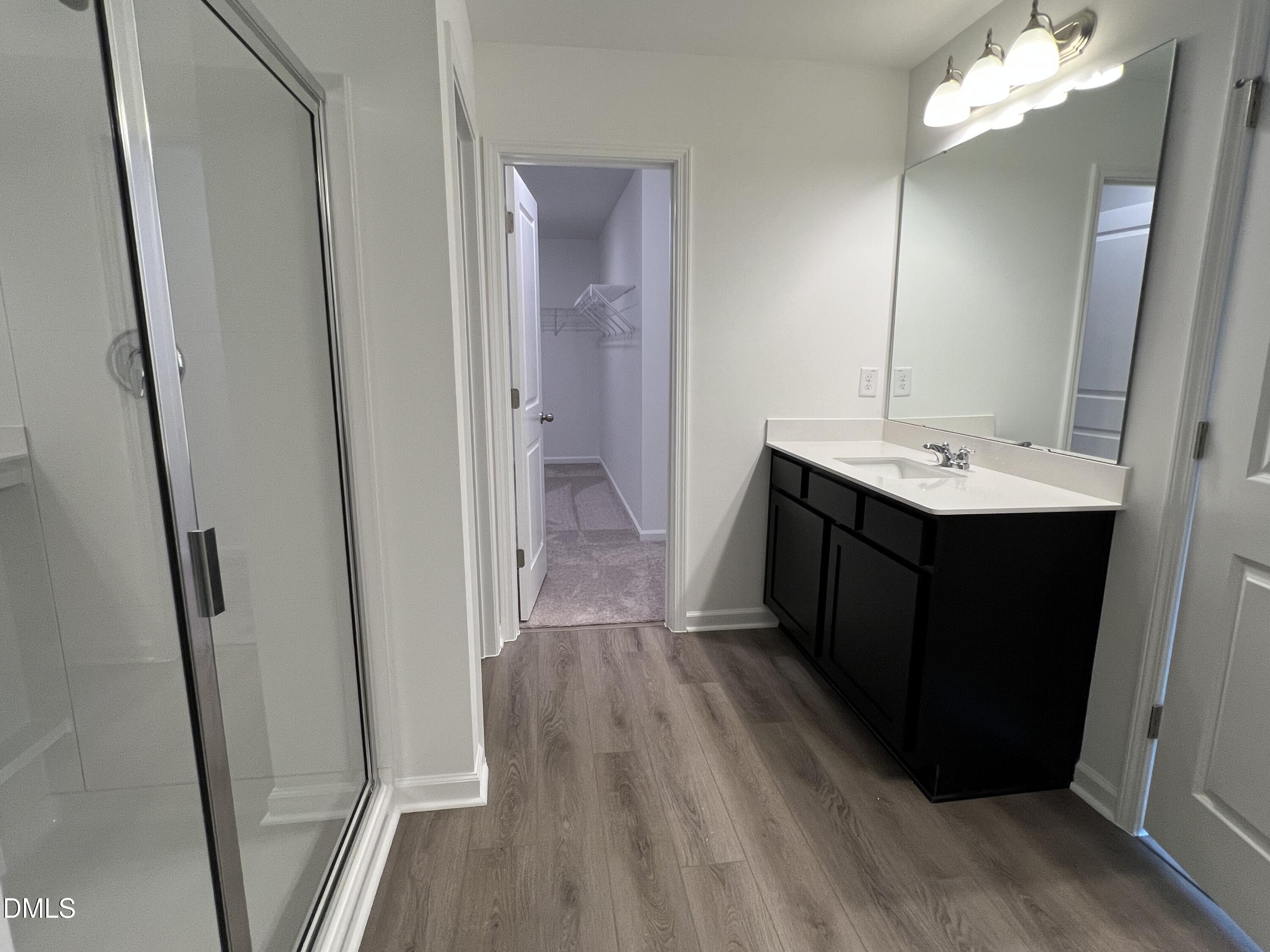 2017 Regal Drive Durham, NC 27703 - Photo 13 of 28 a bathroom with a sink a mirror and a shower