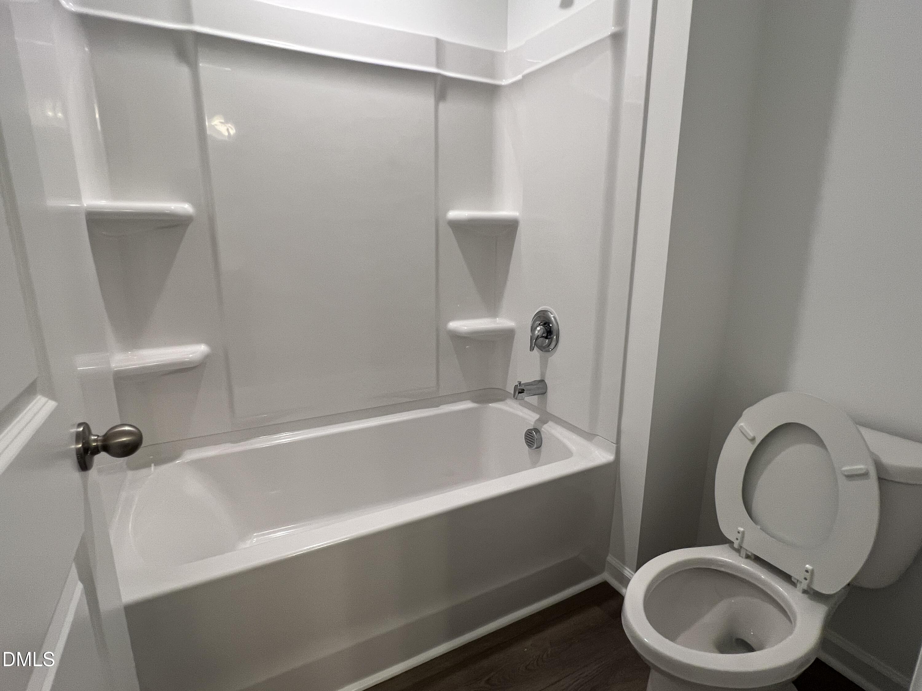 2017 Regal Drive Durham, NC 27703 - Photo 20 of 28 a bathroom with a sink a toilet and a bathtub