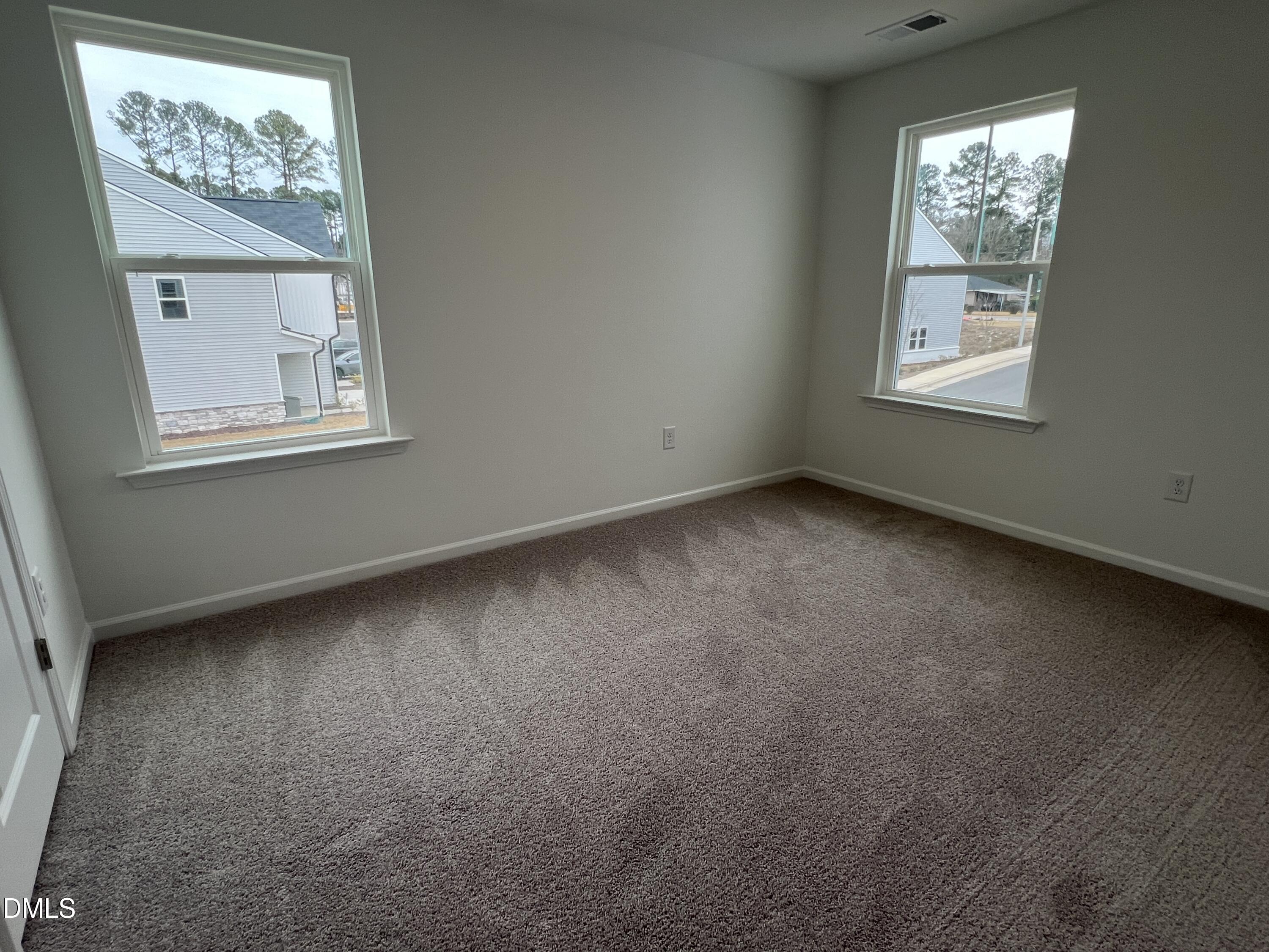 2017 Regal Drive Durham, NC 27703 - Photo 21 of 28 an empty room with windows
