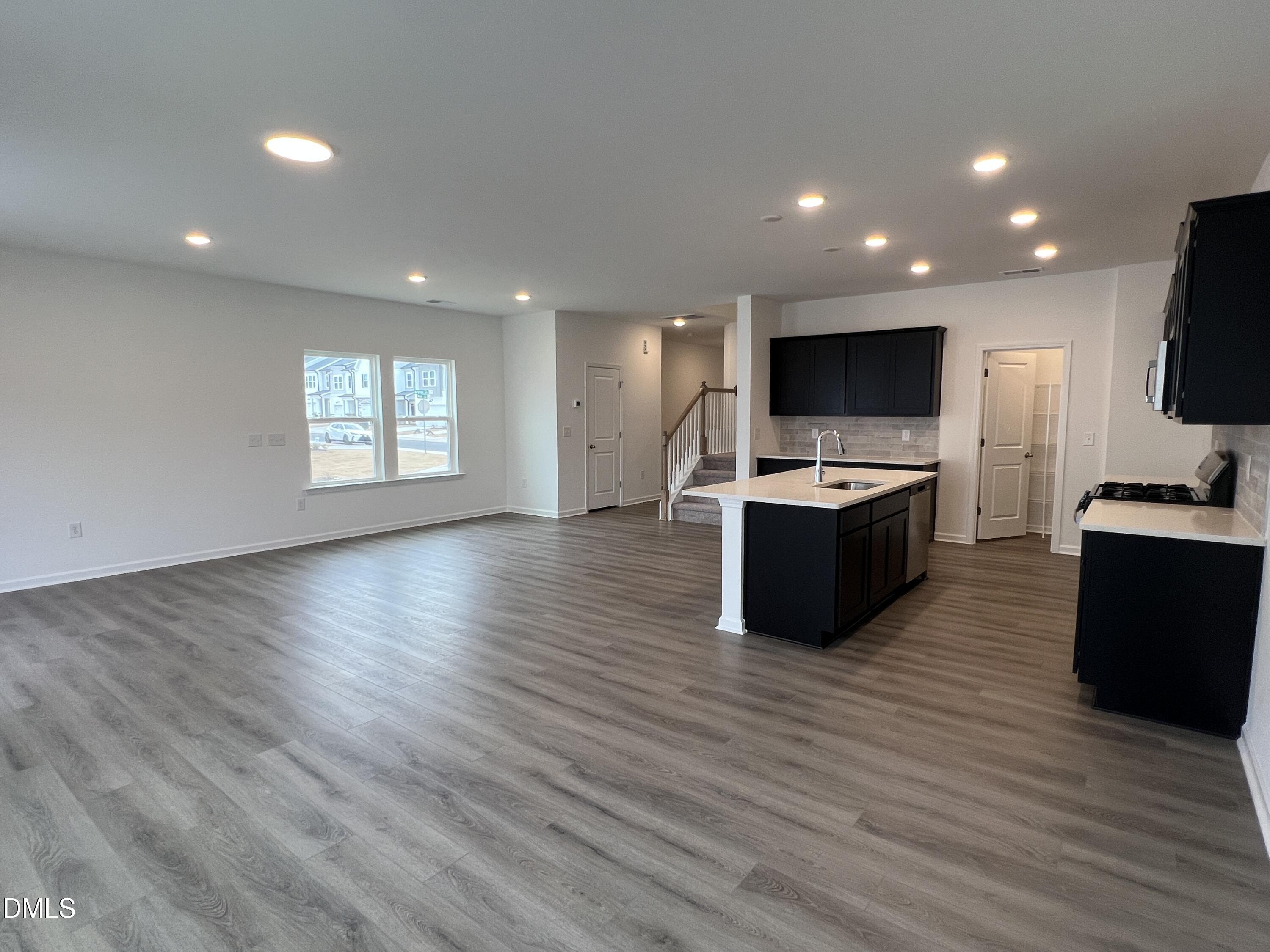 2017 Regal Drive Durham, NC 27703 - Photo 7 of 28 a living room with furniture and a flat screen tv