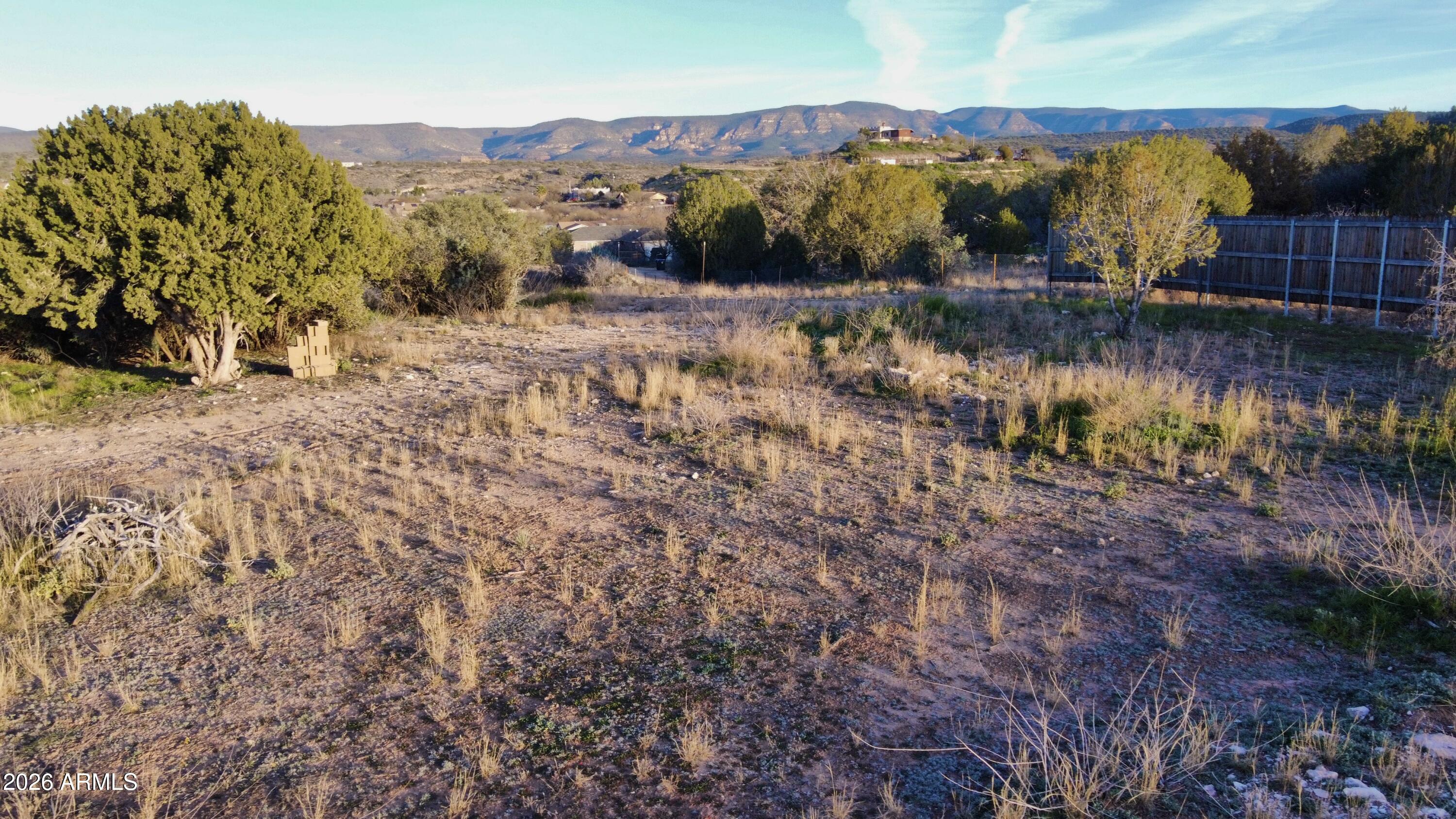 5625 North Robin Lynn Lane Rimrock, AZ 86335 - Photo 13 of 24 a view of a lake with mountains in the background