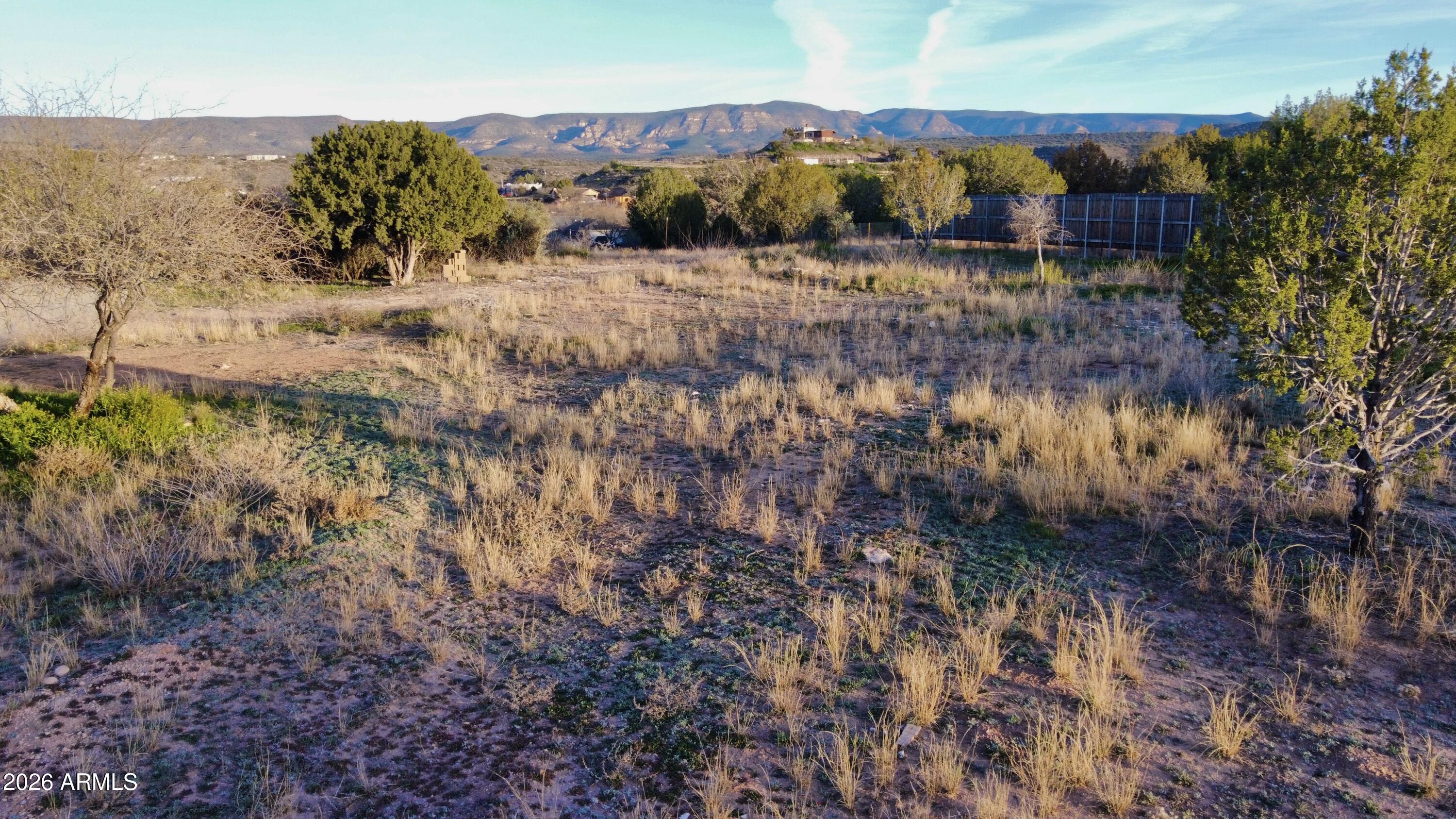 5625 North Robin Lynn Lane Rimrock, AZ 86335 - Photo 18 of 24 a view of a yard with wooden fence