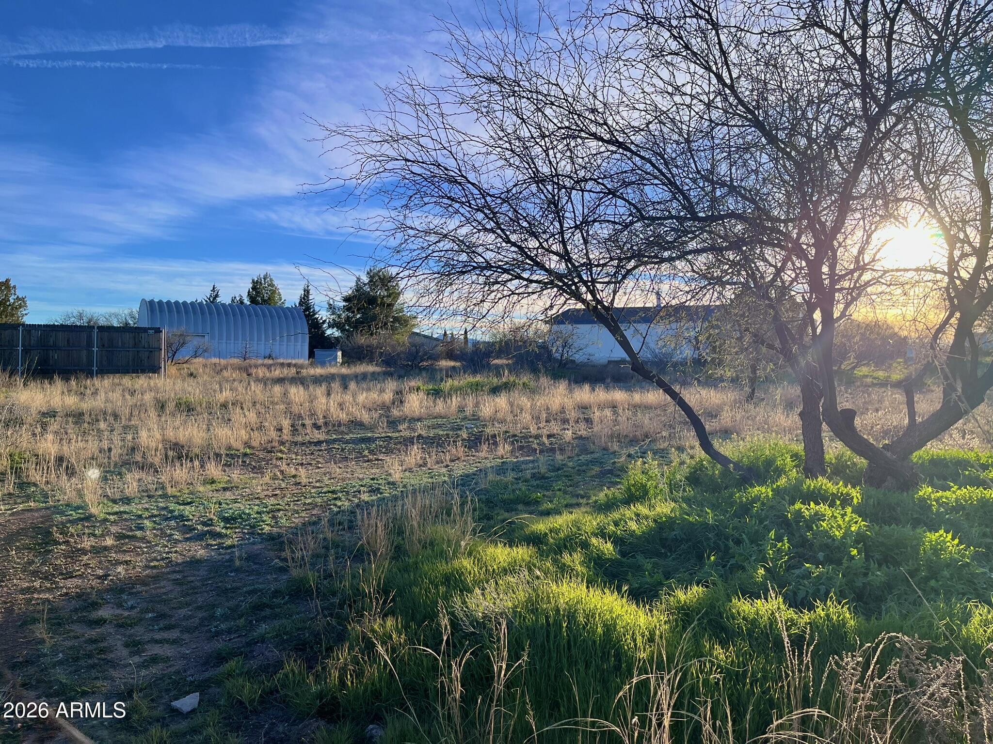 5625 North Robin Lynn Lane Rimrock, AZ 86335 - Photo 22 of 24 a view of a lake with a house in the background