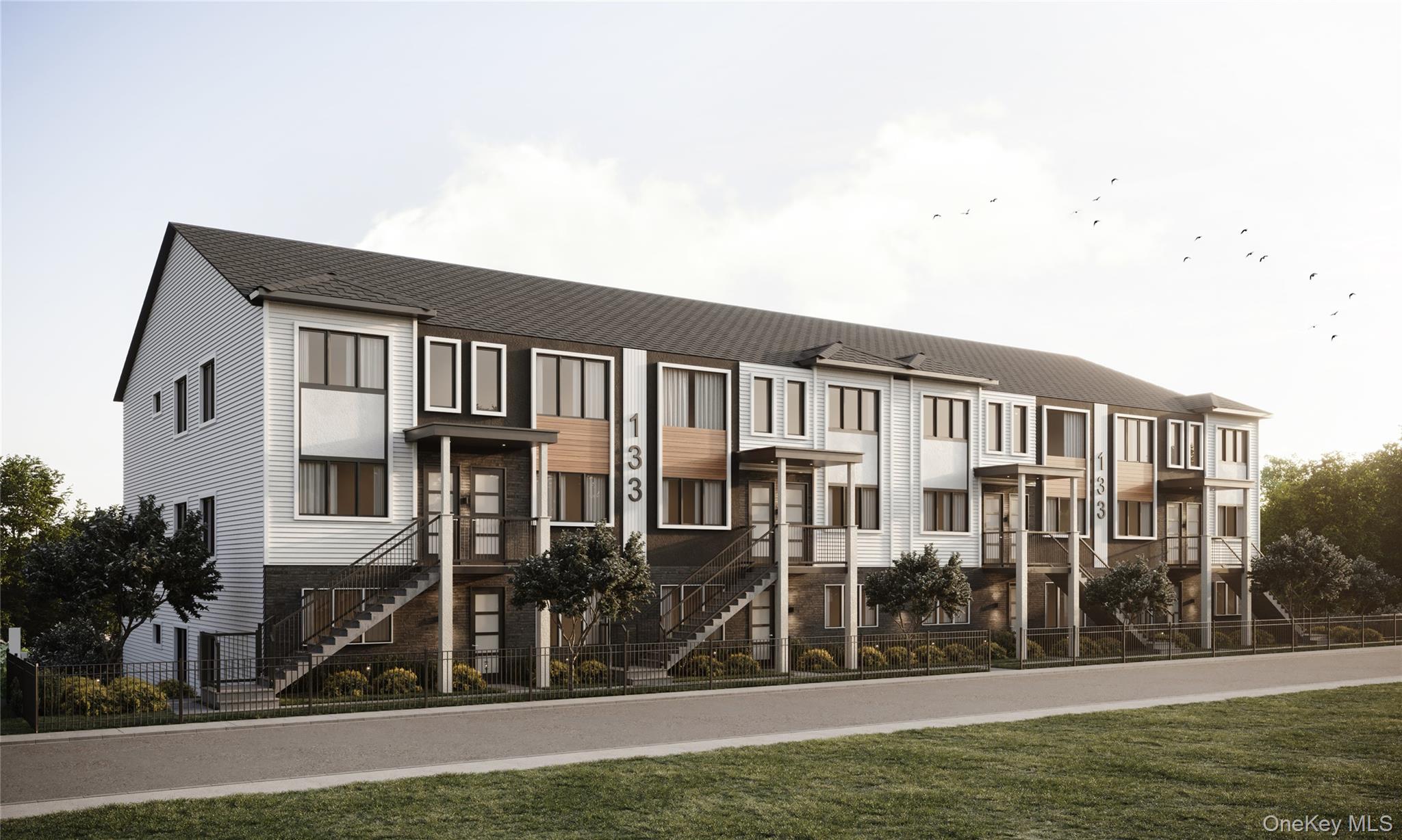 View of property featuring a fenced front yard