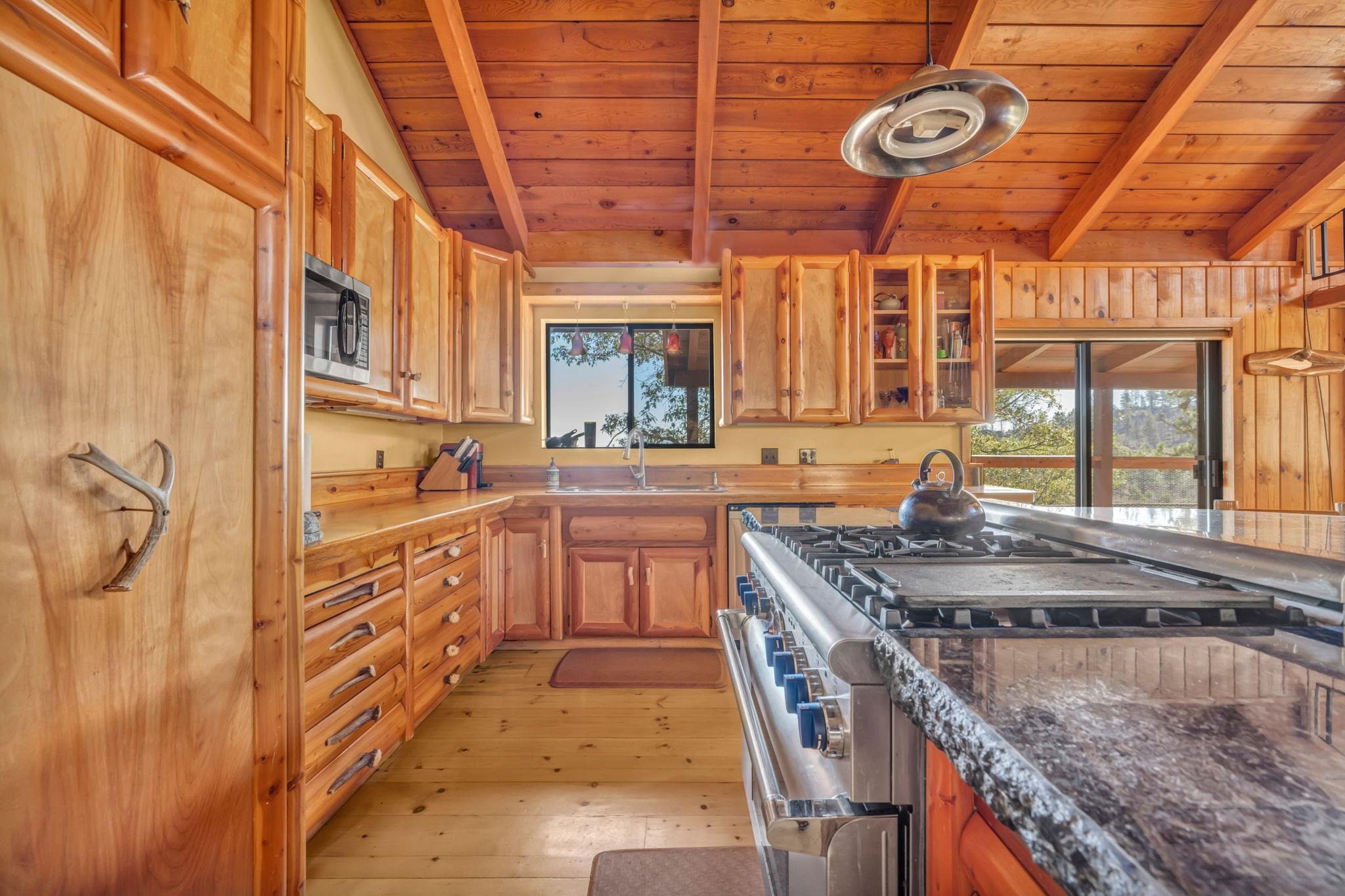 740-935 Sugar Loaf Road Doyle, CA 96109 - Photo 13 of 25 a kitchen with stainless steel appliances granite countertop a sink and cabinets