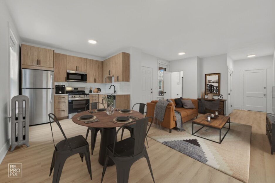 6977 North Bell Avenue, Unit 3 Chicago, IL 60645 - Photo 3 of 15 a living room with furniture a refrigerator and a dining table