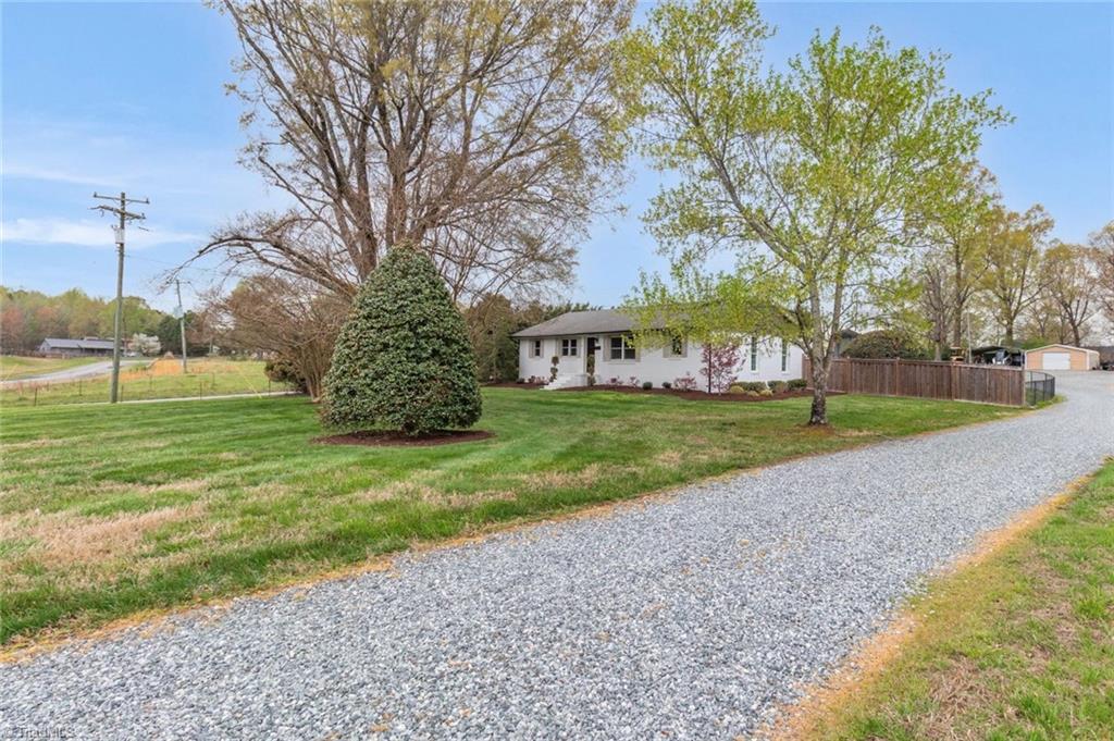6408 Mowery Road Climax, NC 27233 - Photo 11 of 33 Long gravel driveway leading up to the house