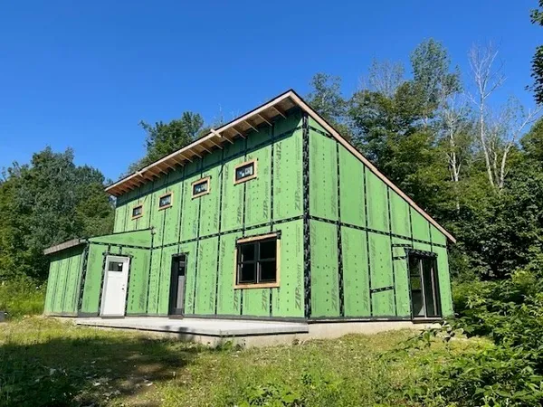 a view of a back yard of the house
