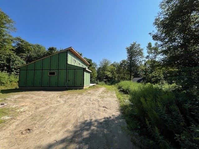 961 Peru Road Windsor, MA 01270 - Photo 23 of 23 a house with trees in front of it