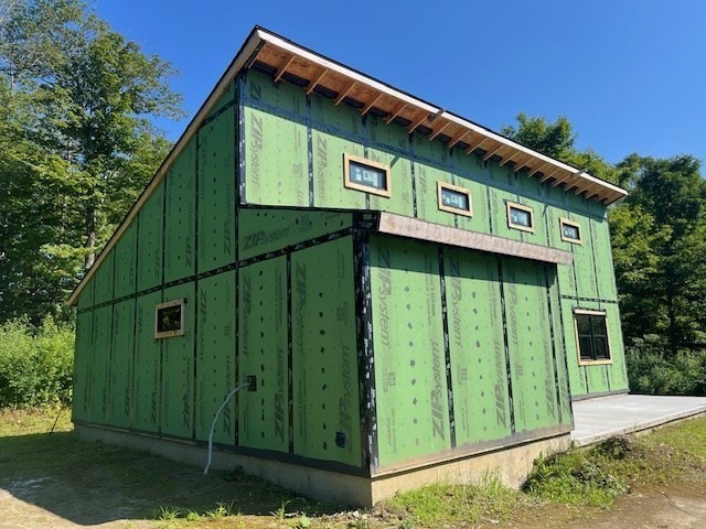 961 Peru Road Windsor, MA 01270 - Photo 3 of 23 a front view of a house with garden