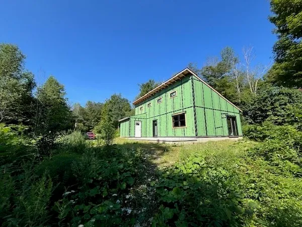 a house with trees in the background