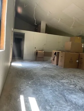 a view of a hallway with a window