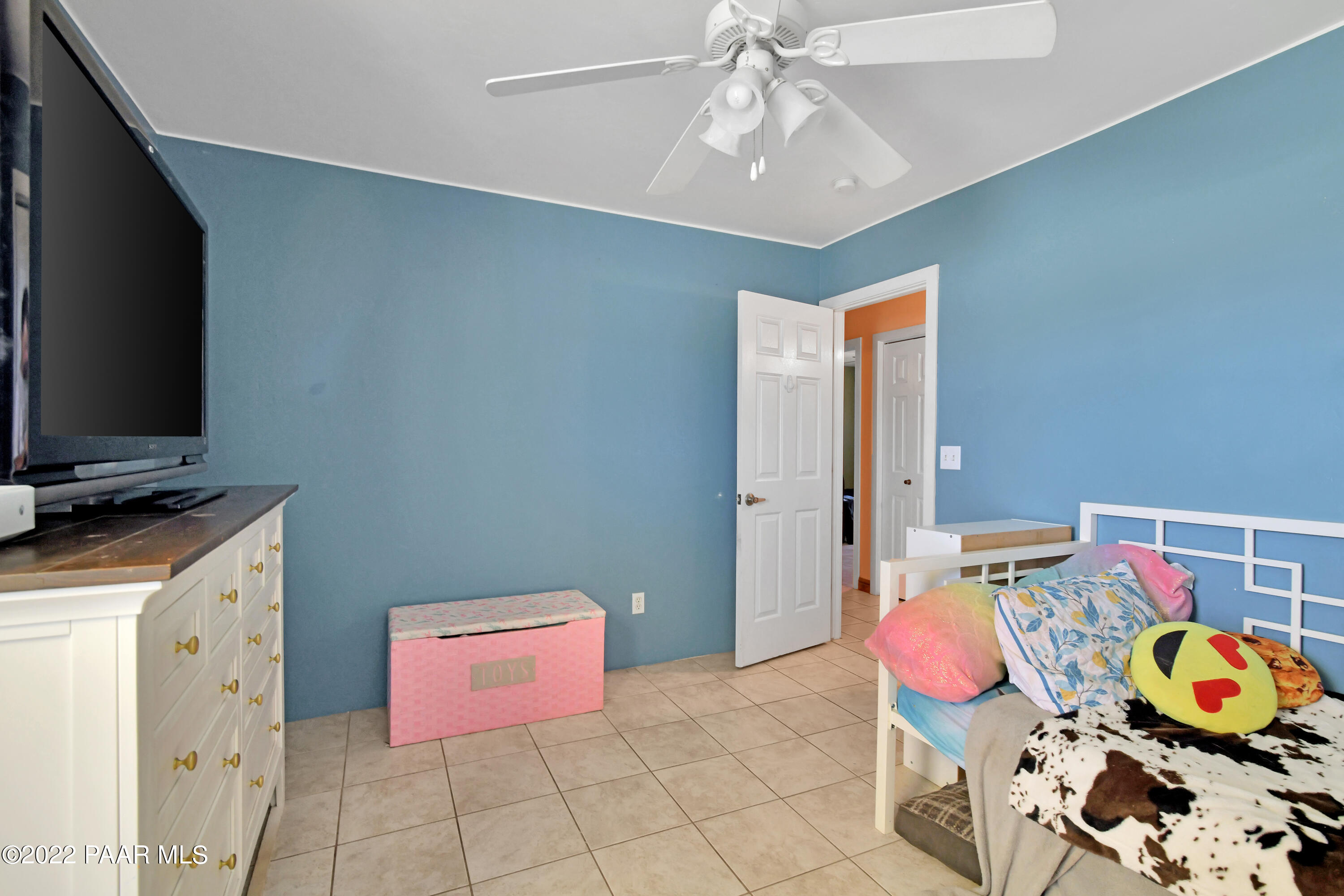 25820 Poppy Road Paulden, AZ 86334 - Photo 15 of 28 a bedroom with furniture and a flat screen tv